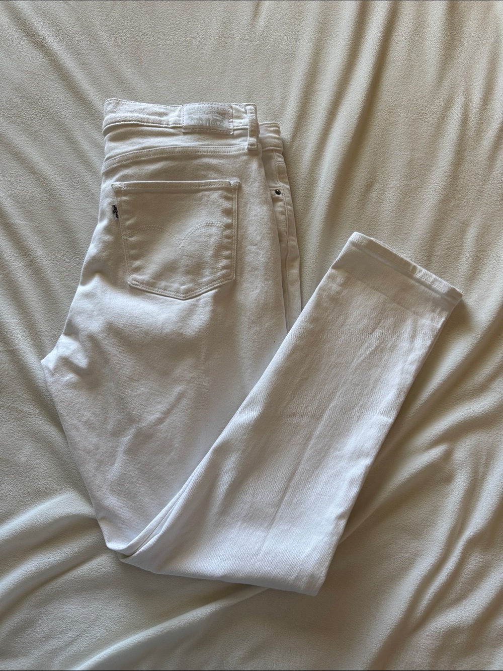 Levi’s 311 white jeans